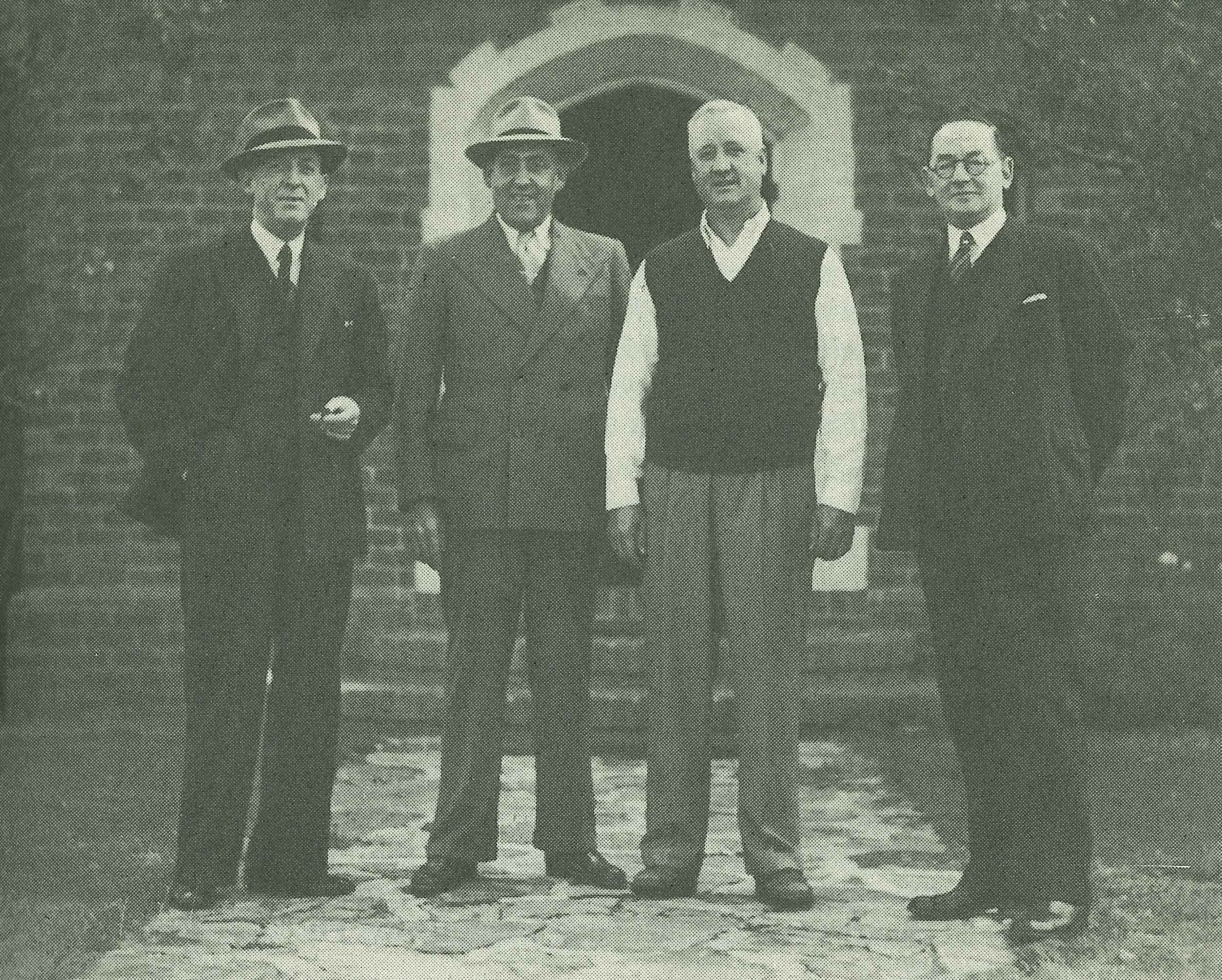The four directors, Jewson, Lester, Todd and Abbott, outside the clubhouse