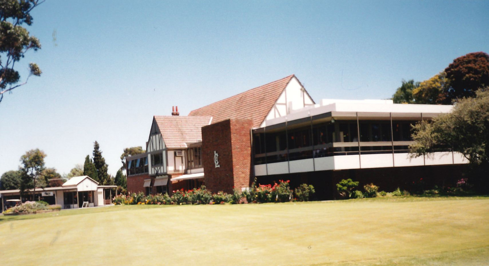The extended clubhouse from outside, showing the new wing alongside the original Tudor structure